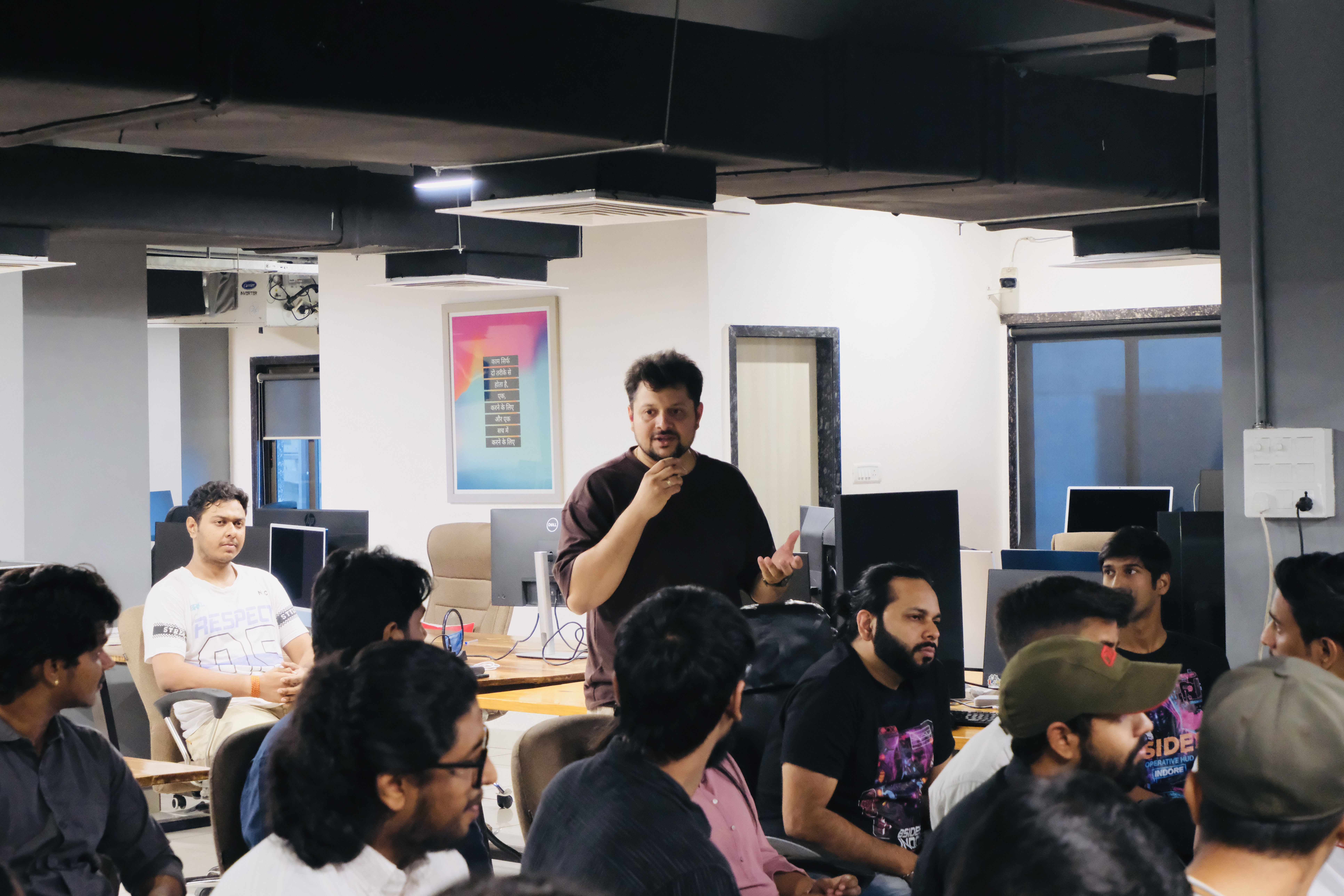Harshal Saraf speaking during the open-floor portion of the Claude meetup
